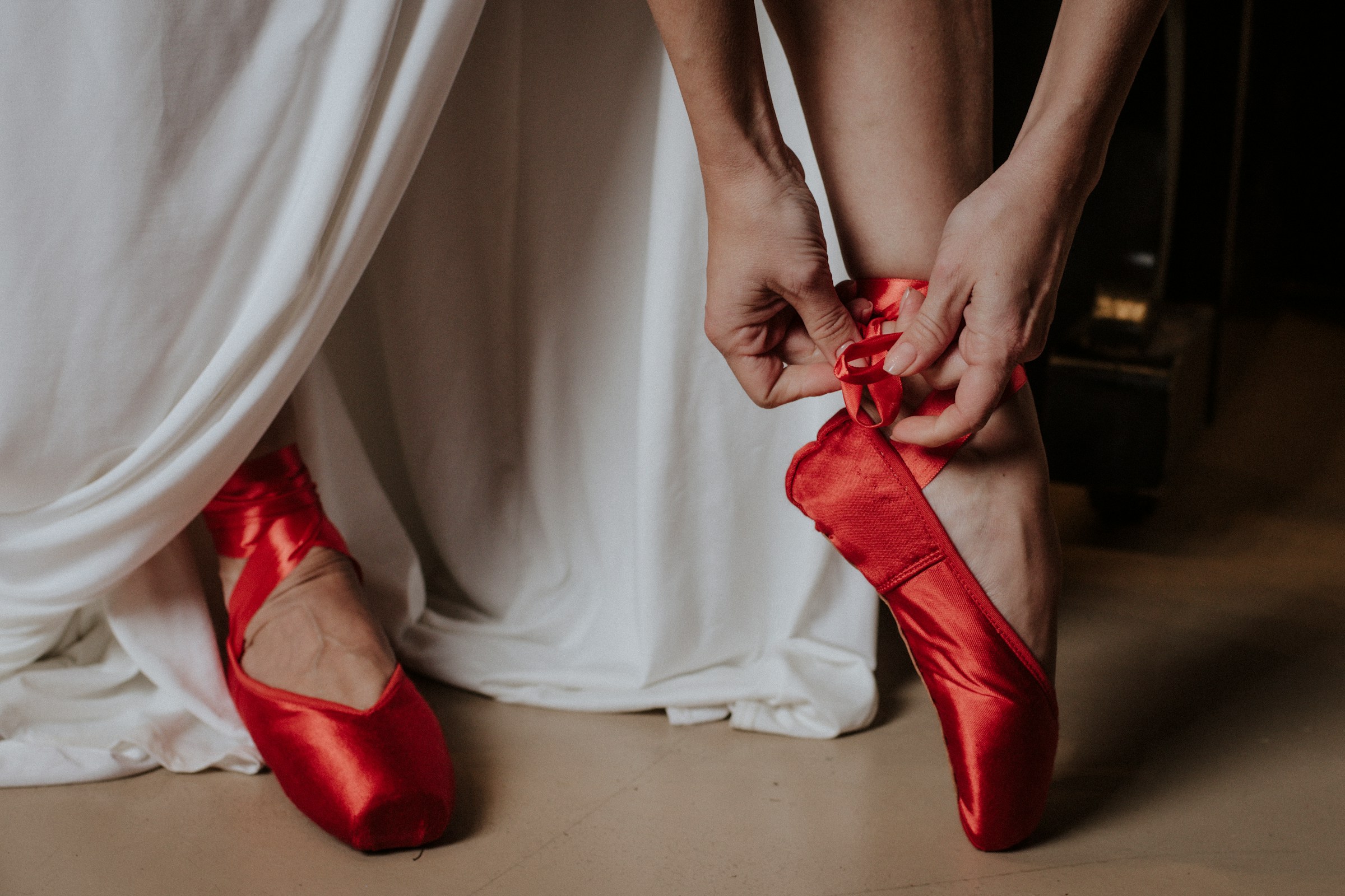 woman in red leather peep toe heeled shoes