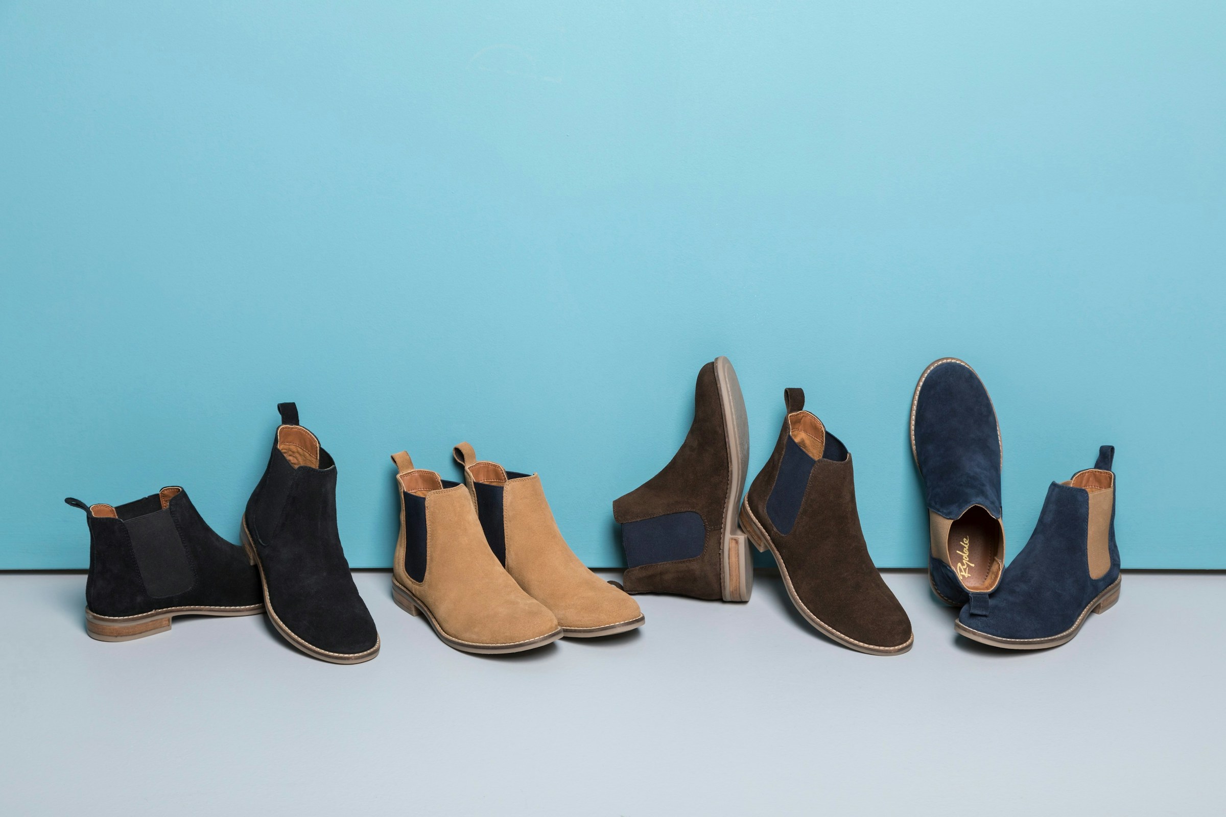 Suede chelsea boots shot on a blue background Image taken by Rydale Clothing to be used in an article and now released under Creative Commons. Please feel free to use as you see fit. We request attribution in the form of a link to www.rydale.com/